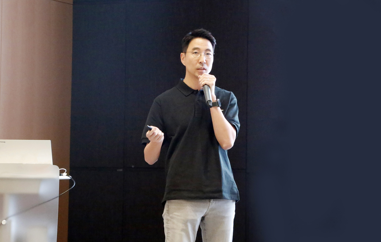 Doosan Robotics CEO Kim Min-pyo speaks at a town hall meeting at the Bundang Doosan Towser in Seongnam, Gyeonggi Province, Monday. (Doosan Robotics)