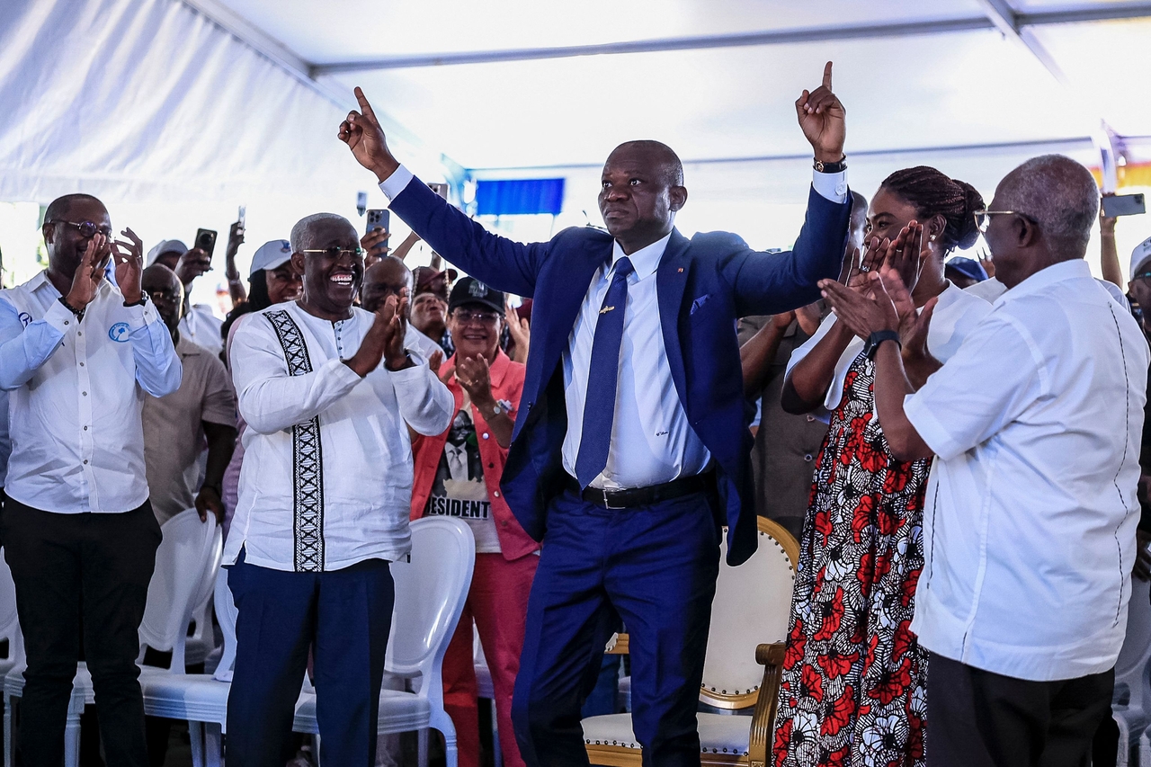 Gabon's junta chief Brice Oligui Nguema (center) celebrates winning the presidential election in Libreville, Gabon, Sunday. (AFP-Yonhap)
