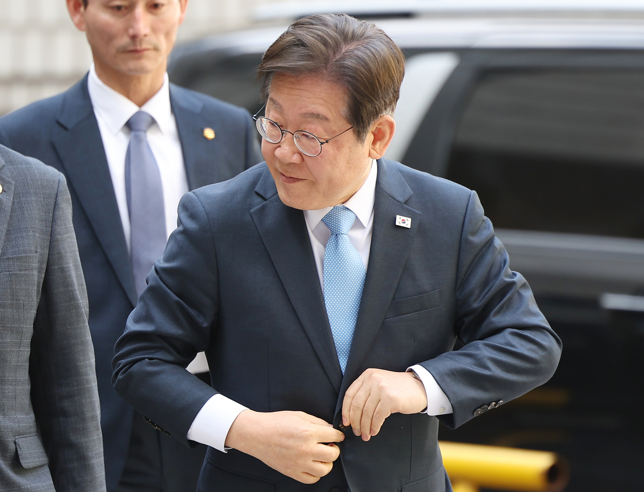 Democratic Party of Korea's former leader, Rep. Lee Jae-myung, appears for a court hearing Tuesday. Yonhap