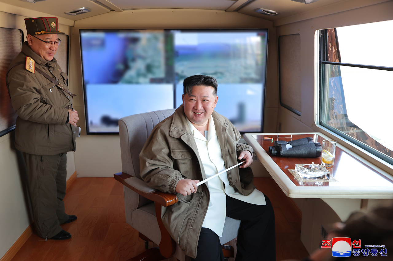 This image, captured from the Rodong Sinmun daily on March 21, 2025, shows North Korean leader Kim Jong-un smiling contentedly after a missile test. Yonhap