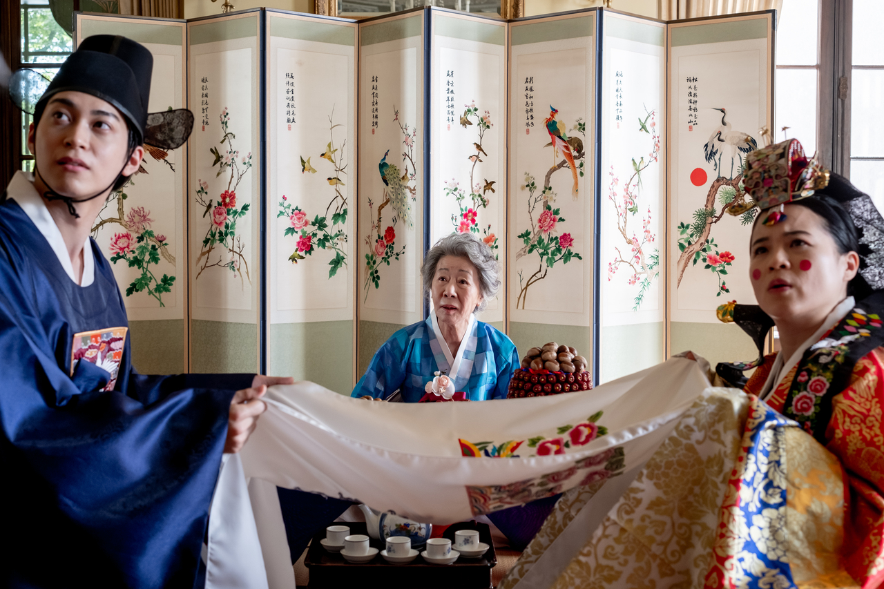 From left: Han Gi-Chan, Youn Yuh-Jung and Kelly Marie Tran in "The Wedding Banquet" (Bleecker Street Films)
