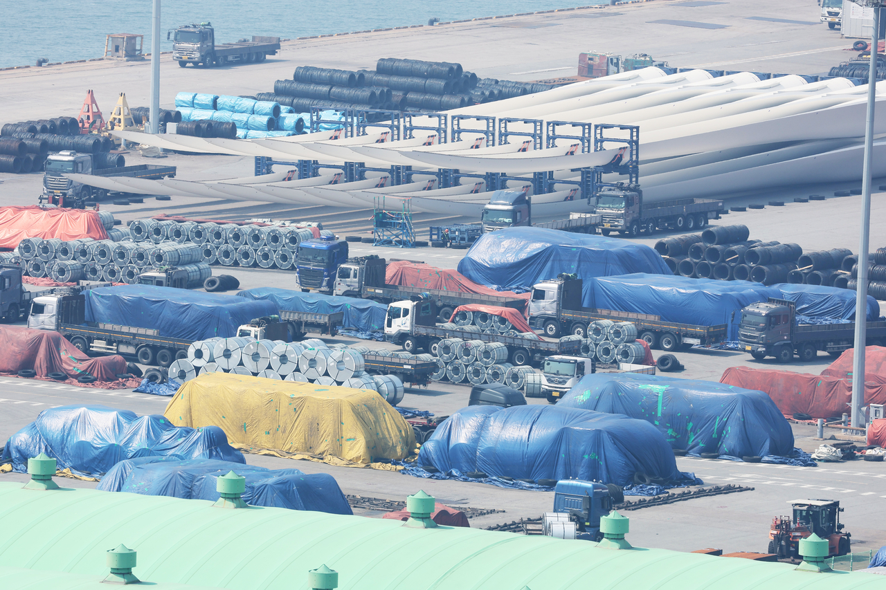 Steel products are piled up at a port in Pyeongtaek, Gyeonggi Province, on April 3. (Yonhap)