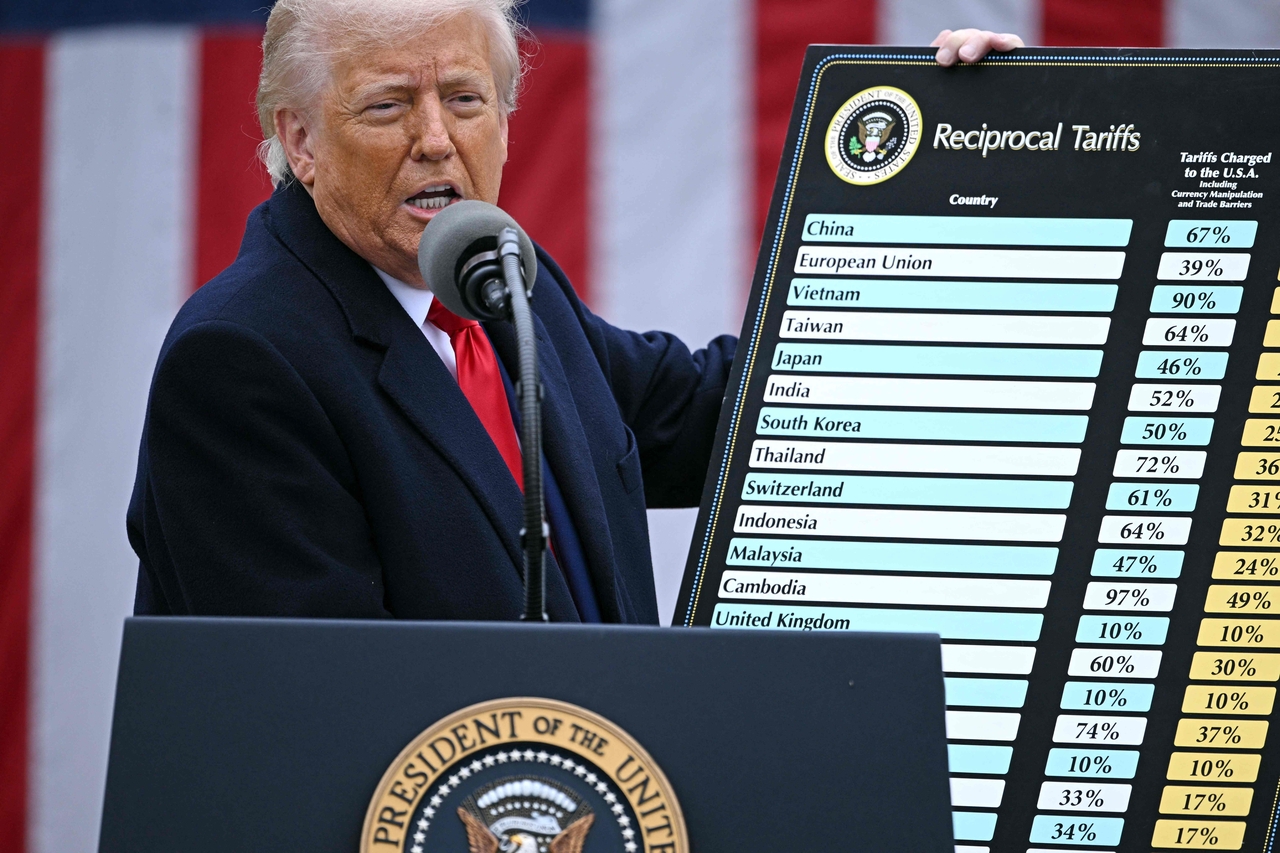 US President Donald Trump holds a chart as he delivers remarks on reciprocal tariffs during an event in the Rose Garden entitled "Make America Wealthy Again" at the White House in Washington, DC, on Apr. 2. (AFP-Yonhap)