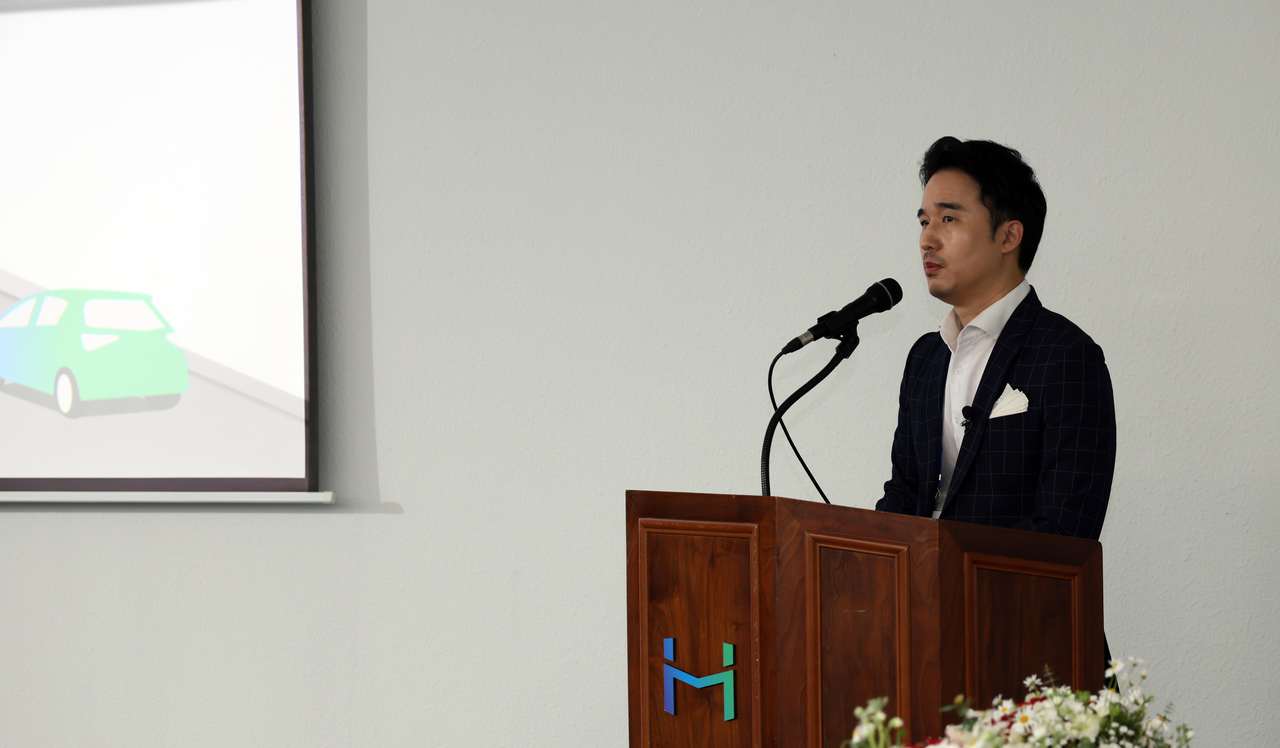 Kim Ik-hwan, vice chair of Hansae Mobility, gives a presentation about the company during a media tour Wednesday at the Hansae Mobility plant in Daegu. (Hansae Mobility)