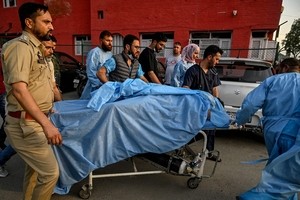 Militants kill dozens of tourists at a resort in Indian-controlled Kashmir