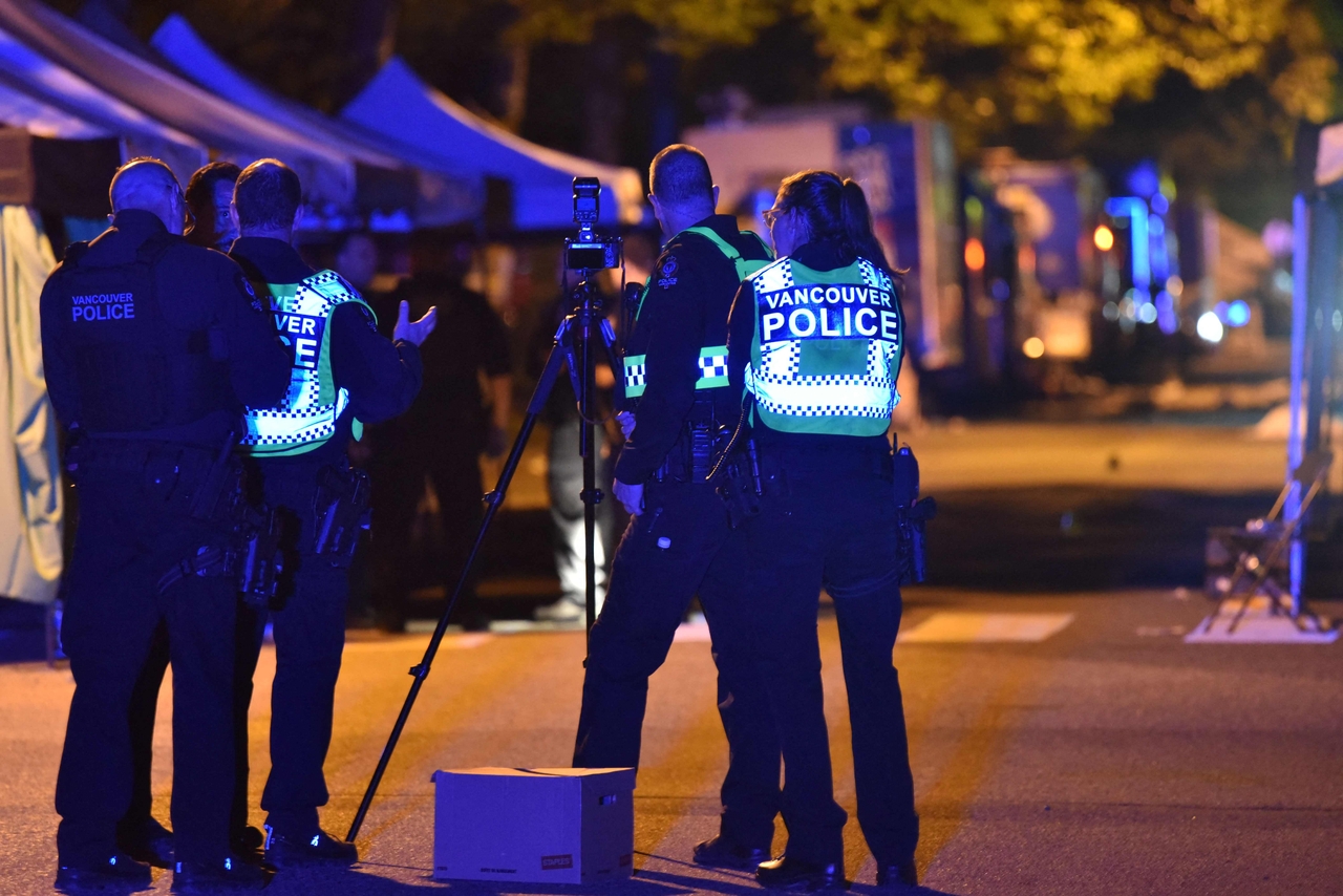 Vancouver police investigate a crime scene after a man drove into pedestrians at the annual Lapu Lapu festival celebrating Filipino culture, at East 43rd Avenue and Fraser, in the south of Vancouver on Sunday. (AFP)