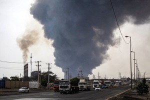 A massive explosion at an Iranian port linked to missile fuel shipment kills 14, injures some 750