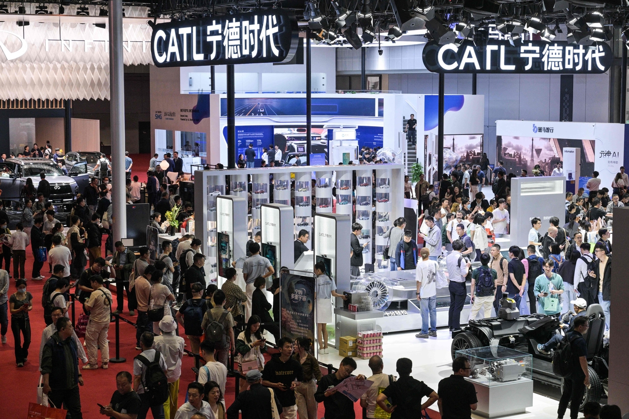 Visitors look around the CATL booth at the 21st Shanghai International Automobile Industry Exhibition at the National Exhibition and Convention Center in Shanghai, Friday. (AFP-Yonhap)