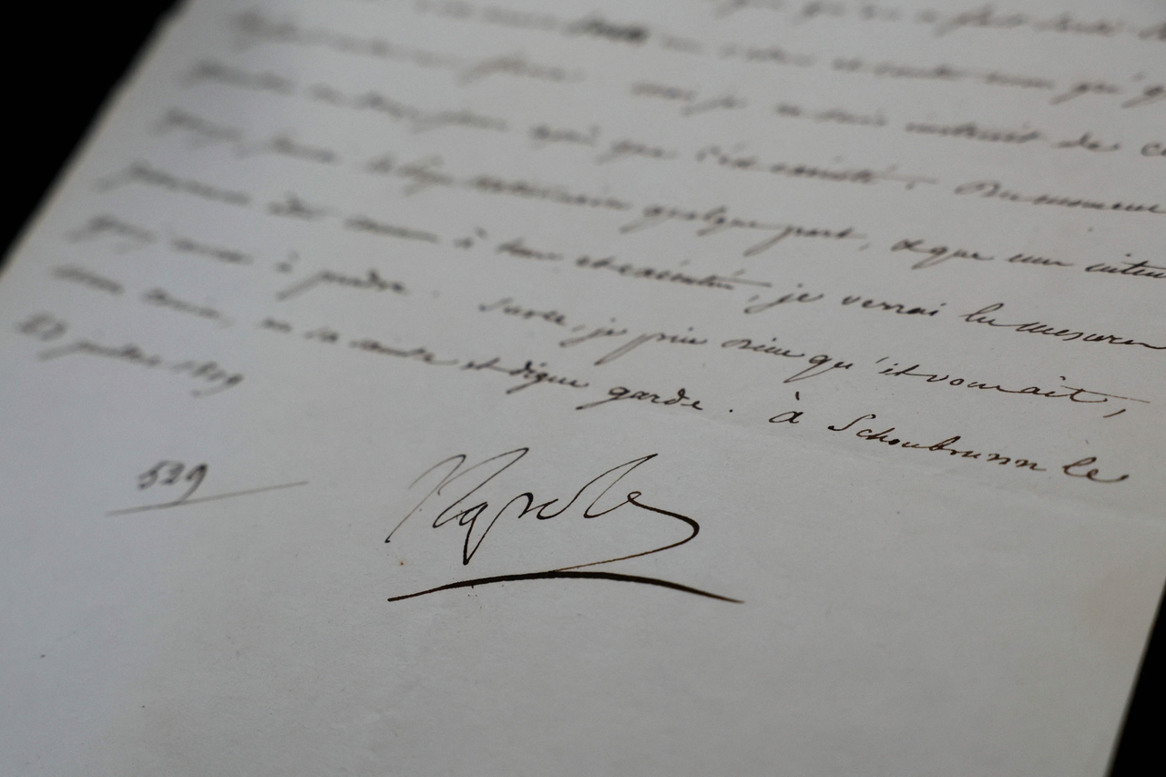 This photograph taken on April 23, 2025, shows a letter dated July 23, 1809, concerning the arrest of Pope Pius VII, written by Napoleon I and signed "Napole," displayed at the Osenat auction house offices in Paris.   (AFP-Yonhap)