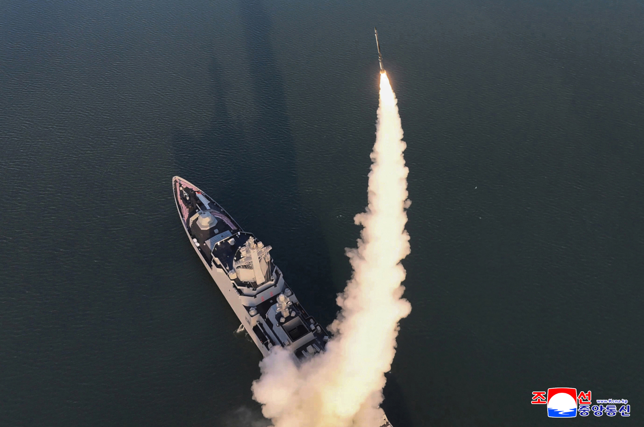North Korea’s new Choe Hyon-class destroyer test-fires a missile, in this photo released by the Korean Central News Agency on Wednesday. (KCNA via Yonhap)