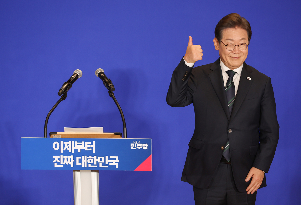 Democratic Party of Korea presidential candidate Rep. Lee Jae-myung stands next to a podium as he launches his official campaign team at the National Assembly on Wednesday. Yonhap