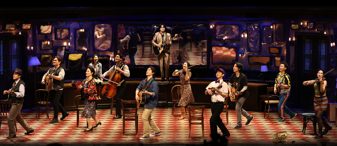 The 12 cast members of "Once" perform on stage during a press conference on Feb. 26 at Coex Artium in Seoul. (Yonhap)