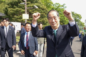Ex-PM Han urges PPP candidate to keep promise to merge candidacies
