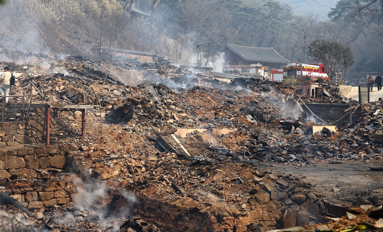 Remains of the destroyed buildings at Gounsa in Uiseong-gun, North Gyeongsang Province, are seen on March 26, after the wildfires in the southeast region inflicted a devastating level of destruction to the Buddhist temple over a thousand years old. (Lee Sang-sub/The Korea Herald)