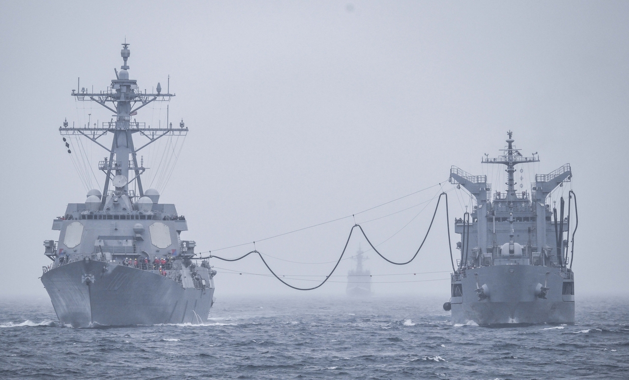 The US Navy's USS William P. Lawrence (left) and South Korea's ROKS Daecheong conduct a combined maritime drill in the East Sea on Sunday. (Republic of Korea Navy)
