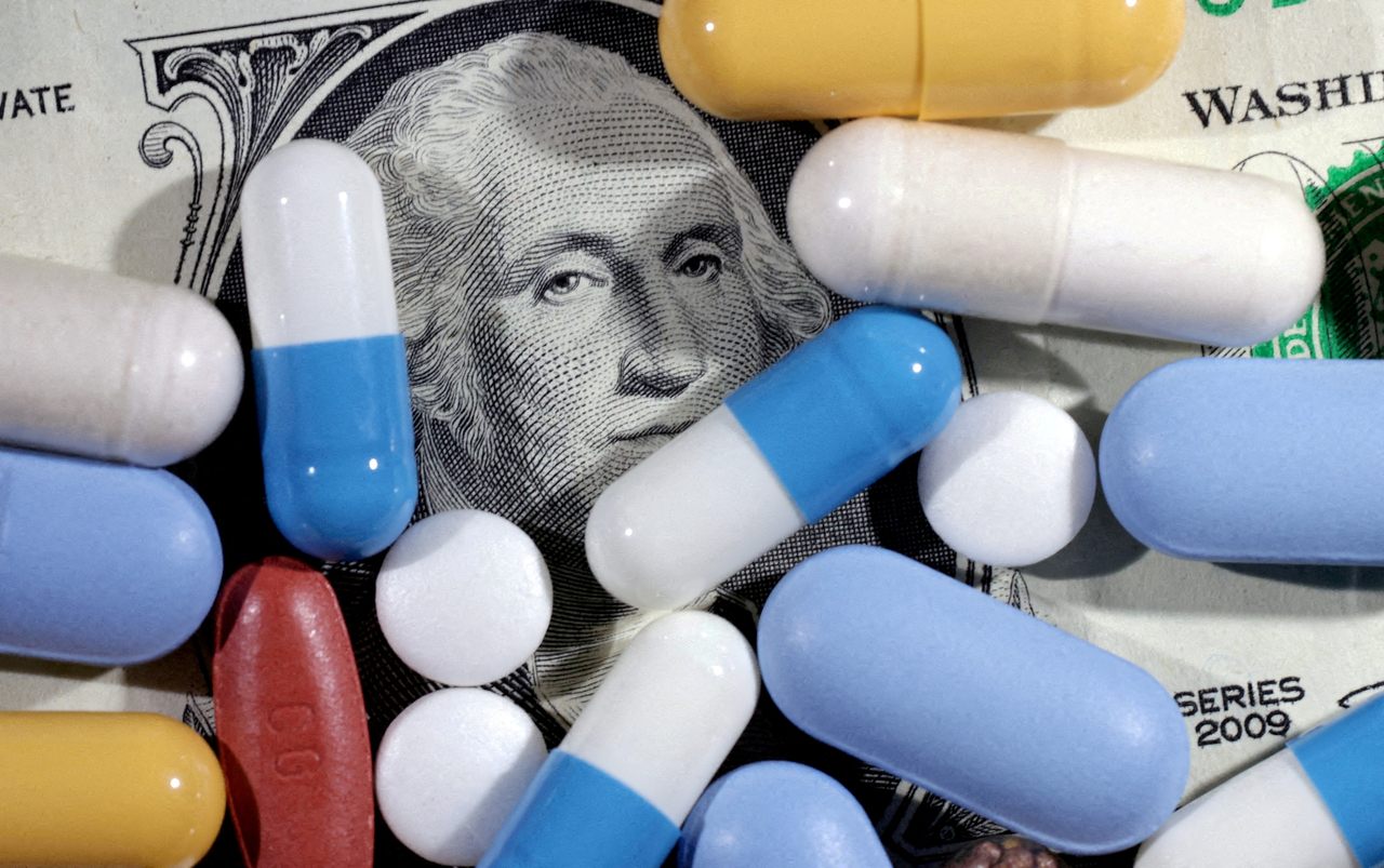 US dollar banknote and medicines are seen.   Reuters-Yonhap