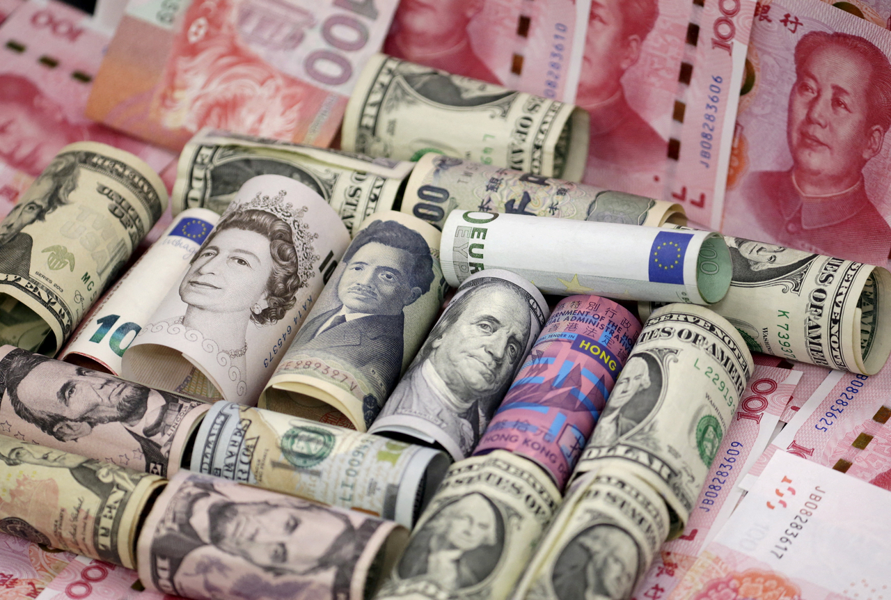 Euro, Hong Kong dollar, US dollar, Japanese yen, pound and Chinese 100 yuan banknotes are seen in this picture.   Reuters-Yonhap