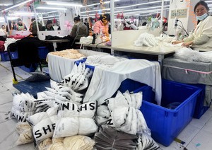 US slashes 'de minimis' tariff on small China parcels to as low as 30%
