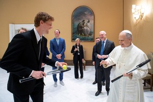 World No. 1 tennis player Jannik Sinner gifts a racket to tennis fan Pope Leo XIV