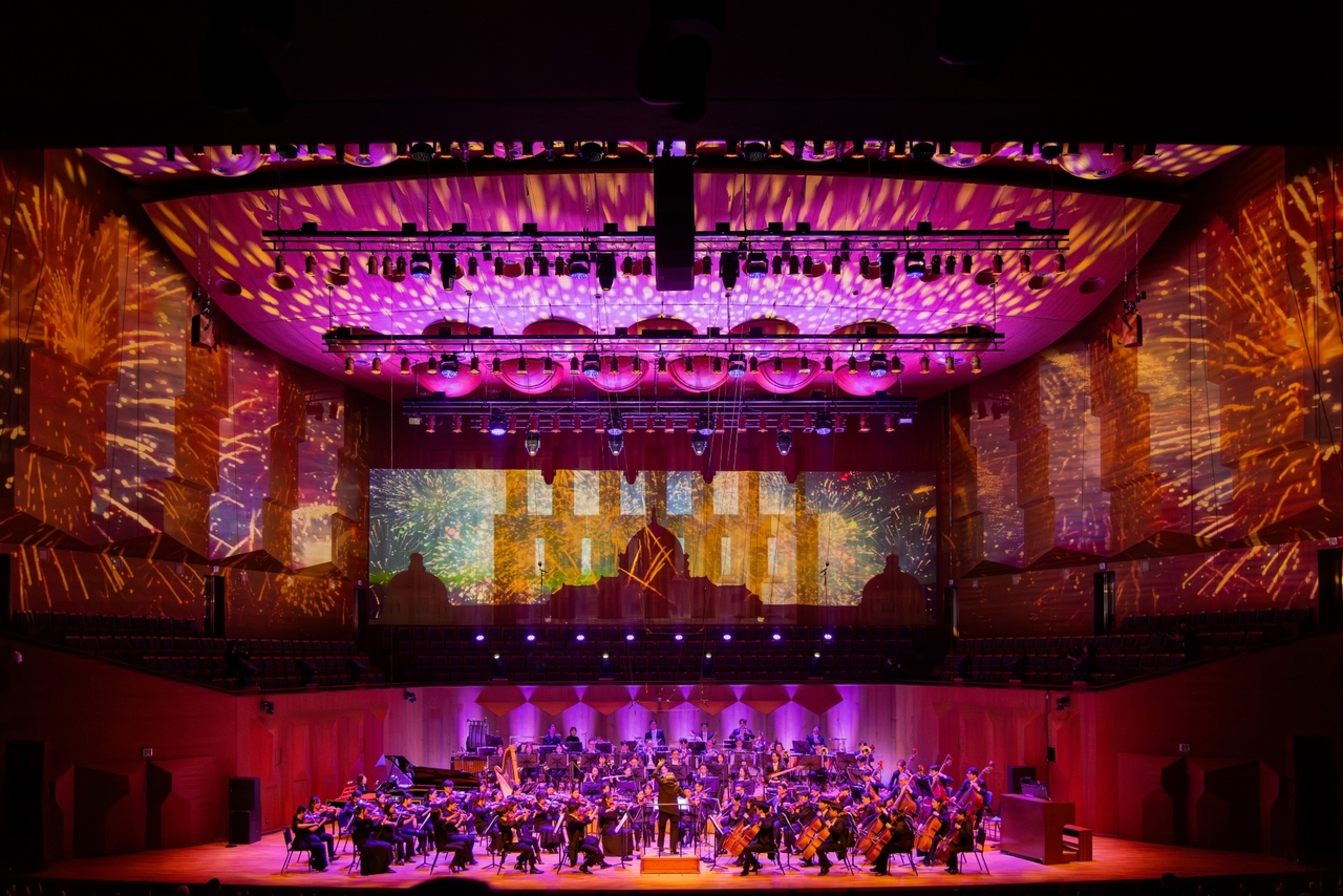 The Seoul Philharmonic Orchestra performs orchestral arrangements of K-pop songs by SM Entertainment artists during the "SM Classics Live" concert at the Seoul Arts Center in February. (SM Entertainment)