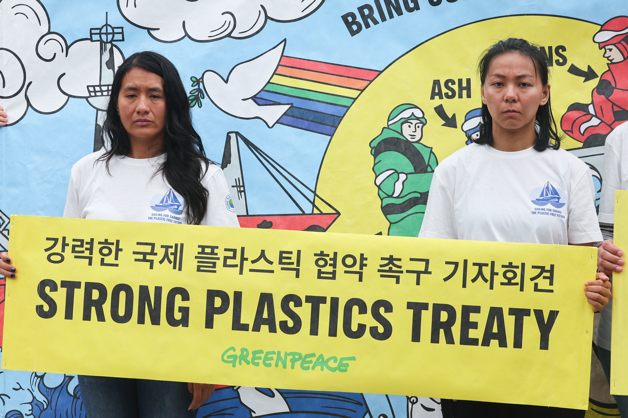 Greenpeace activists hold a press conference after their first court hearing on Friday. (Yonhap)