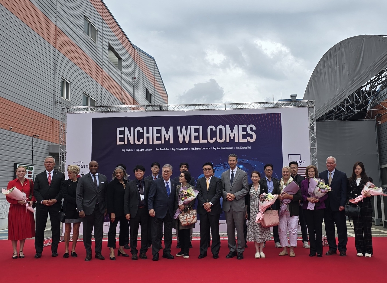 The 8th Former Members of Congress delegation and Enchem executives pose for a photo at Enchem's Cheonan plant in South Chungcheong Province on Friday. (Enchem)