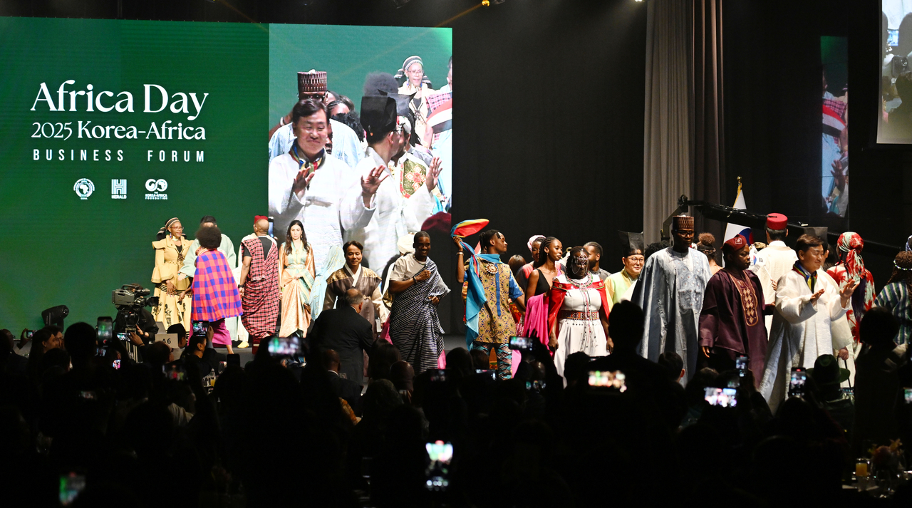 Ambassadors and country representatives in the traditional costume fashion show walk down the runway during the Africa Day 2025 Korea-Africa Business Forum, held at the Grand Hyatt Seoul on Wednesday. (Park Hae-mook/The Korea Herald)