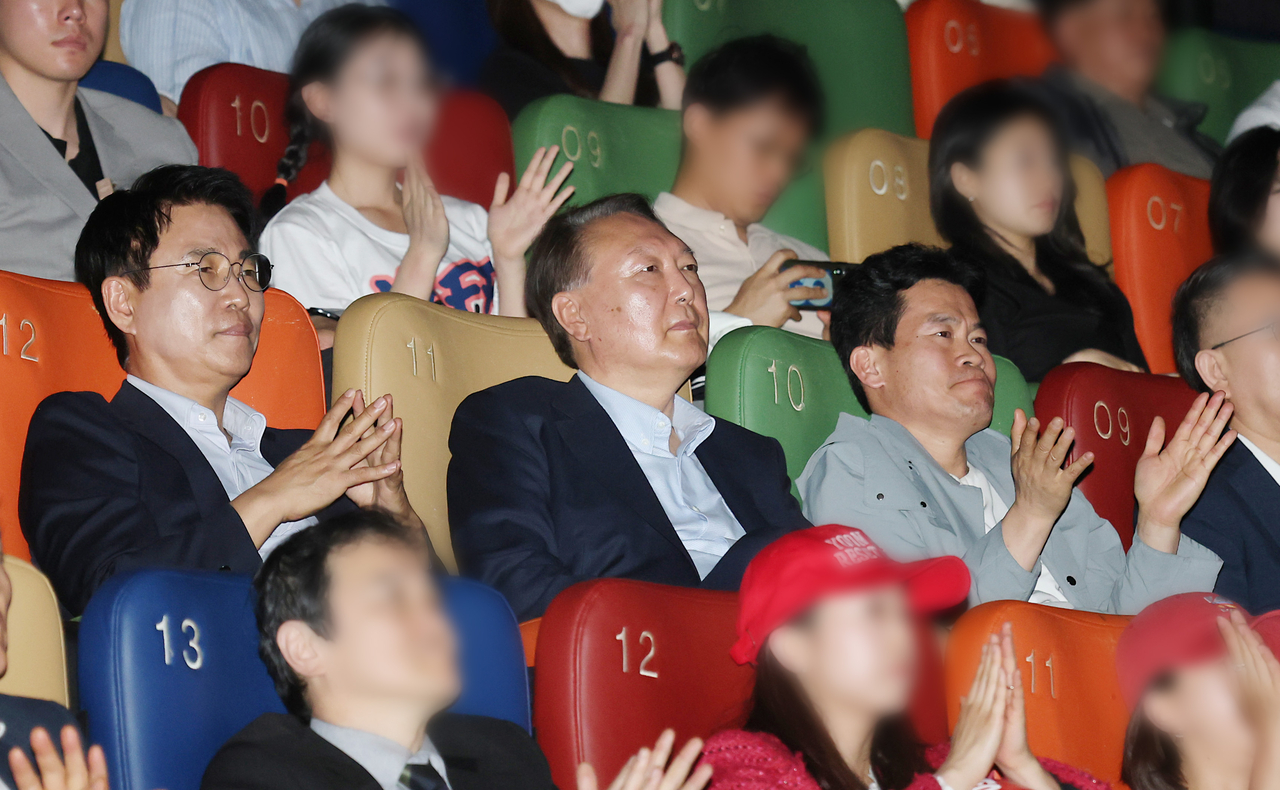 Former President Yoon Suk Yeol receives applause from the audience during a screening of the documentary "Korean Election Fraud, God's Will?" at Megabox Dongdaemun in Seoul on Wednesday. (Yonhap)