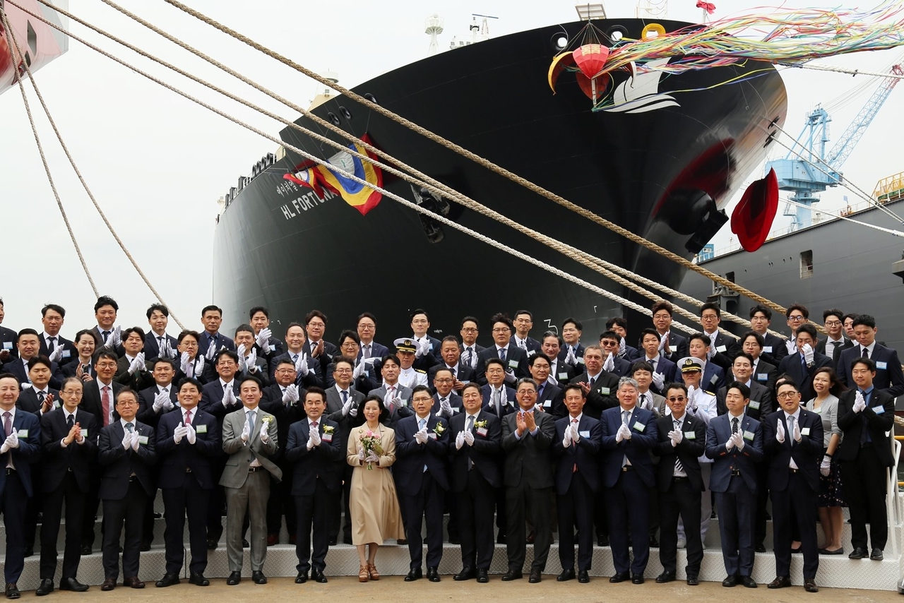 Posco Group executives attend a naming ceremony for the group's first proprietary liquefied natural gas carrier, the HL Fortuna, at HD Hyundai Samho in Mokpo, South Jeolla Province, on Friday. (Posco International)