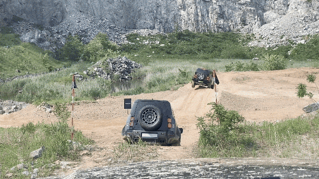 Jaguar Land Rover’s Defender OCTA SUVs undergo off-road test drives on Thursday in Anseong, Gyeonggi Province. (Lim Jae-seong /The Korea Herald)