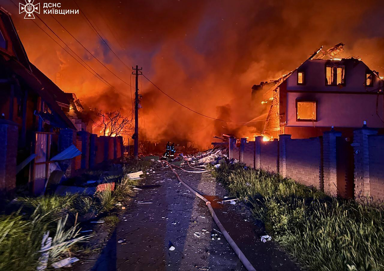 Ukrainian a firefighters operating on burning houses following Russian strike in Kyiv region on Sunday, amid Russian invasion in Ukraine.     Ukrainian State Emergency Service Press Service/UPI-Yonhap