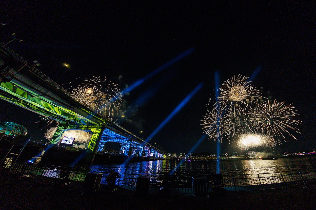 Fireworks burst during the finale of Seventeen’s 10th anniversary concert, "B-Day Party: Burst Stage," held on Jamsu Bridge in Seoul, Sunday. (Pledis Entertainment)