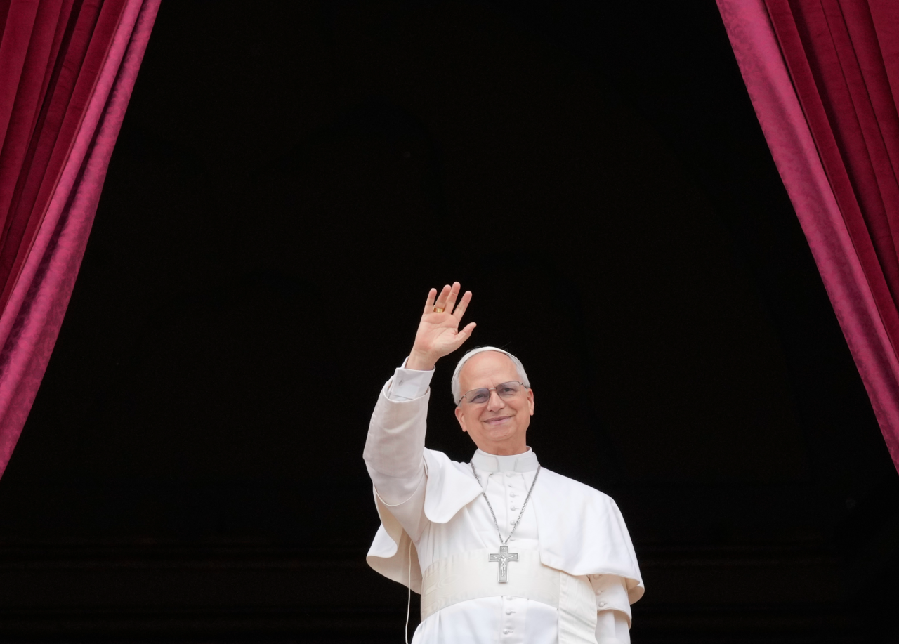 Pope Leo XIV appears on the central balcony of St. Peter’s Basilica in Vatican City to bless the crowd below on Sunday. (AP-Yonhap)
