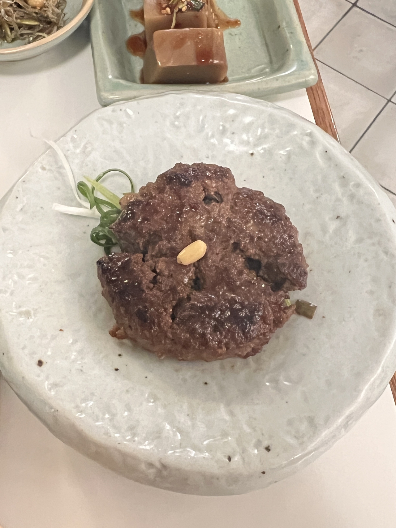 Tteokgalbi, or rib meat patty, served at Grandmother's Recipe in Seoul's Seongsu-dong. (Park Jun-hee/The Korea Herald)
