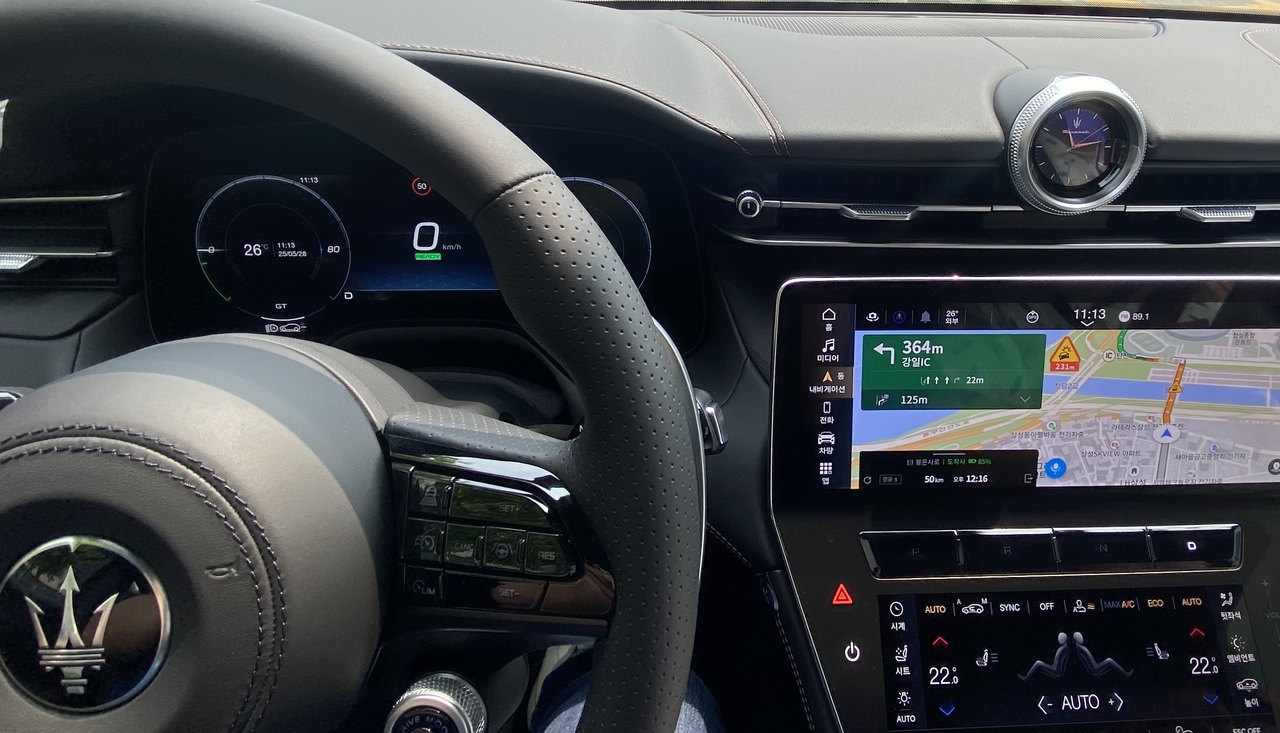 Grecale Folgore’s cockpit features leather-covered controls with contrasting stitching and a signature center clock. (Lim Jae-seong/The Korea Herald)
