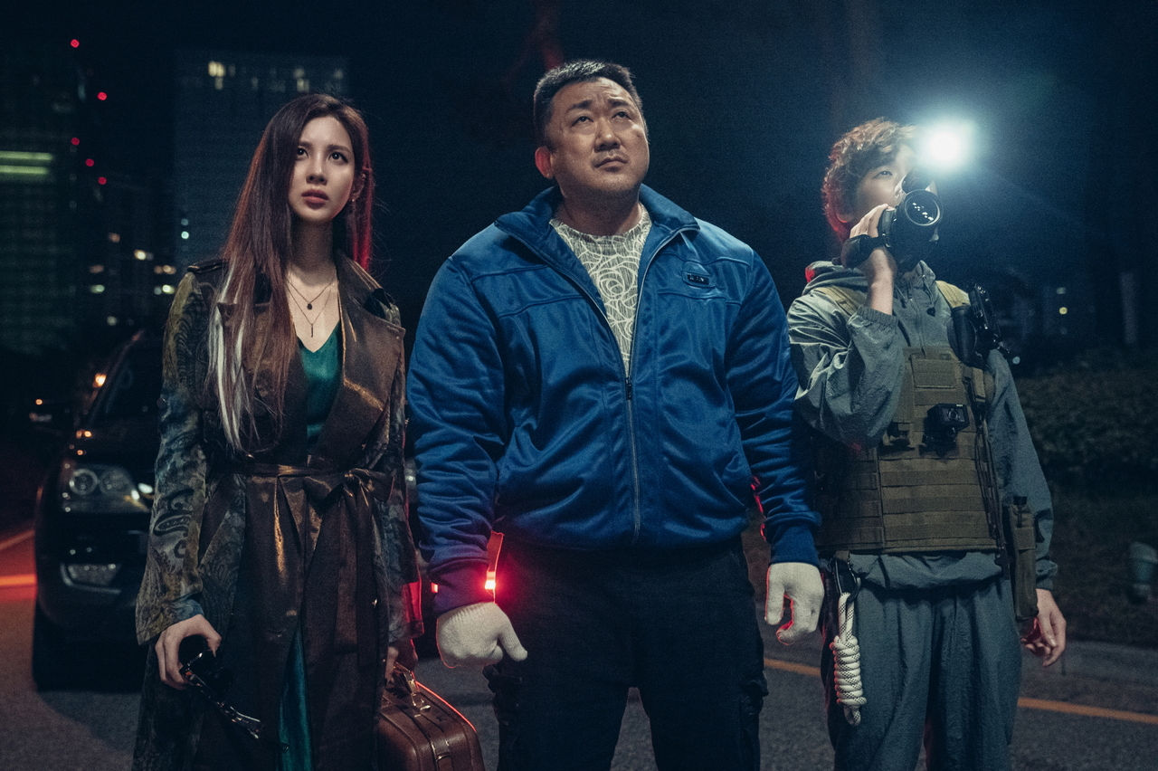 From left: Seohyun, Ma Dong-seok and David Lee star in "Holy Night: Demon Hunters." (Lotte Entertainment)