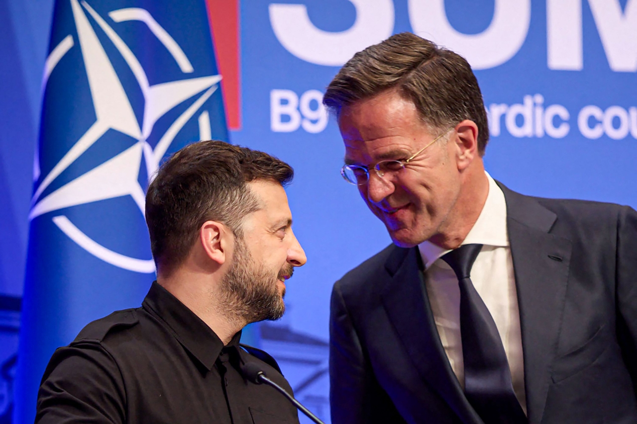 In this handout photograph taken and released by the Ukrainian Presidential Press Service on June 2, 2025, Ukraine's President Volodymyr Zelensky (left) and NATO Secretary-General Mark Rutte speak as they take part in a joint press conference on the sidelines of the Vilnius Summit in Vilnius, amid the Russian invasion of Ukraine.