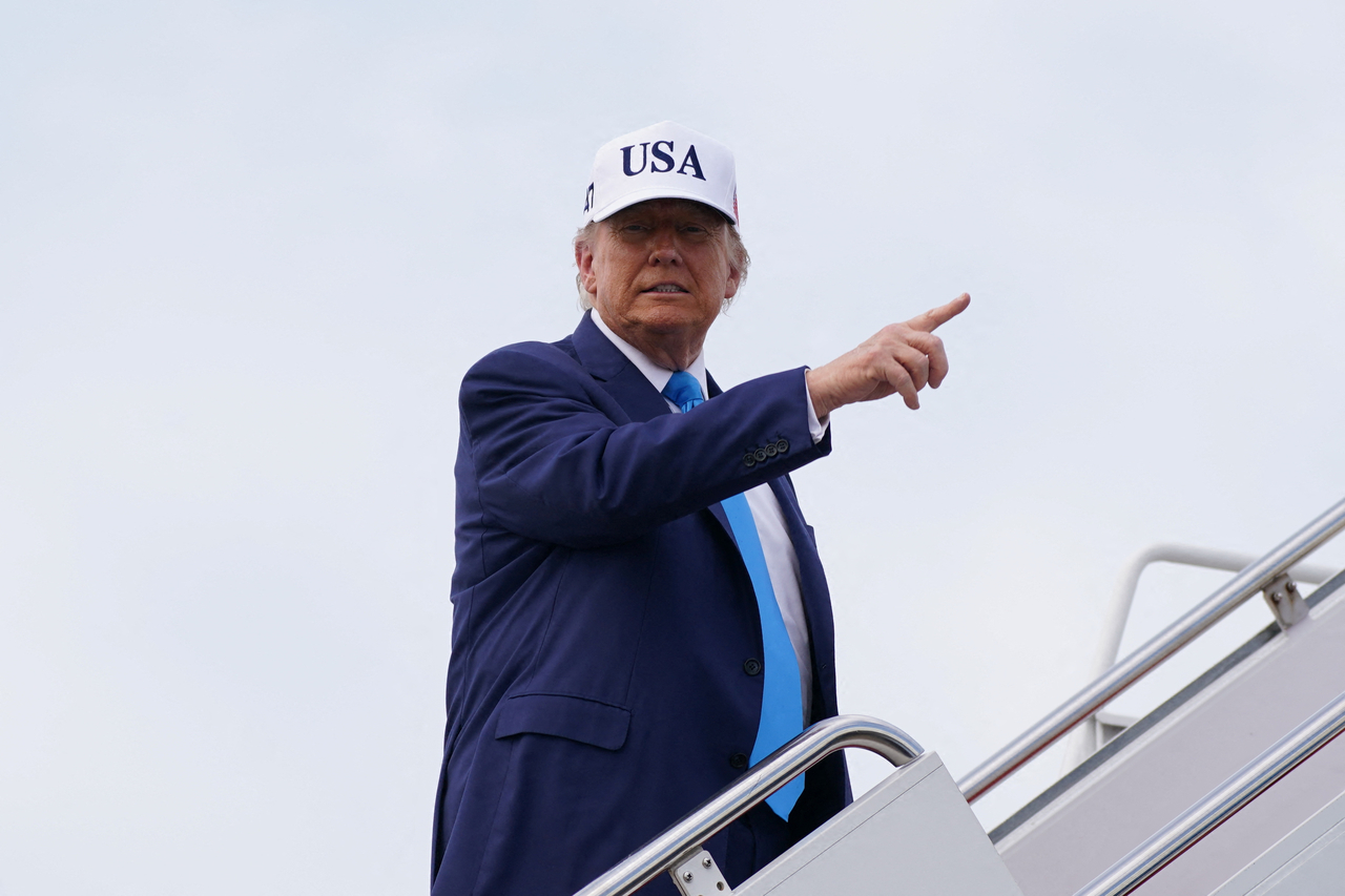 US President Donald Trump gestures while boarding Air Force One as he departs for New Jersey at Joint Base Andrews, Maryland, US, Friday. (Reuters-Yonhap)
