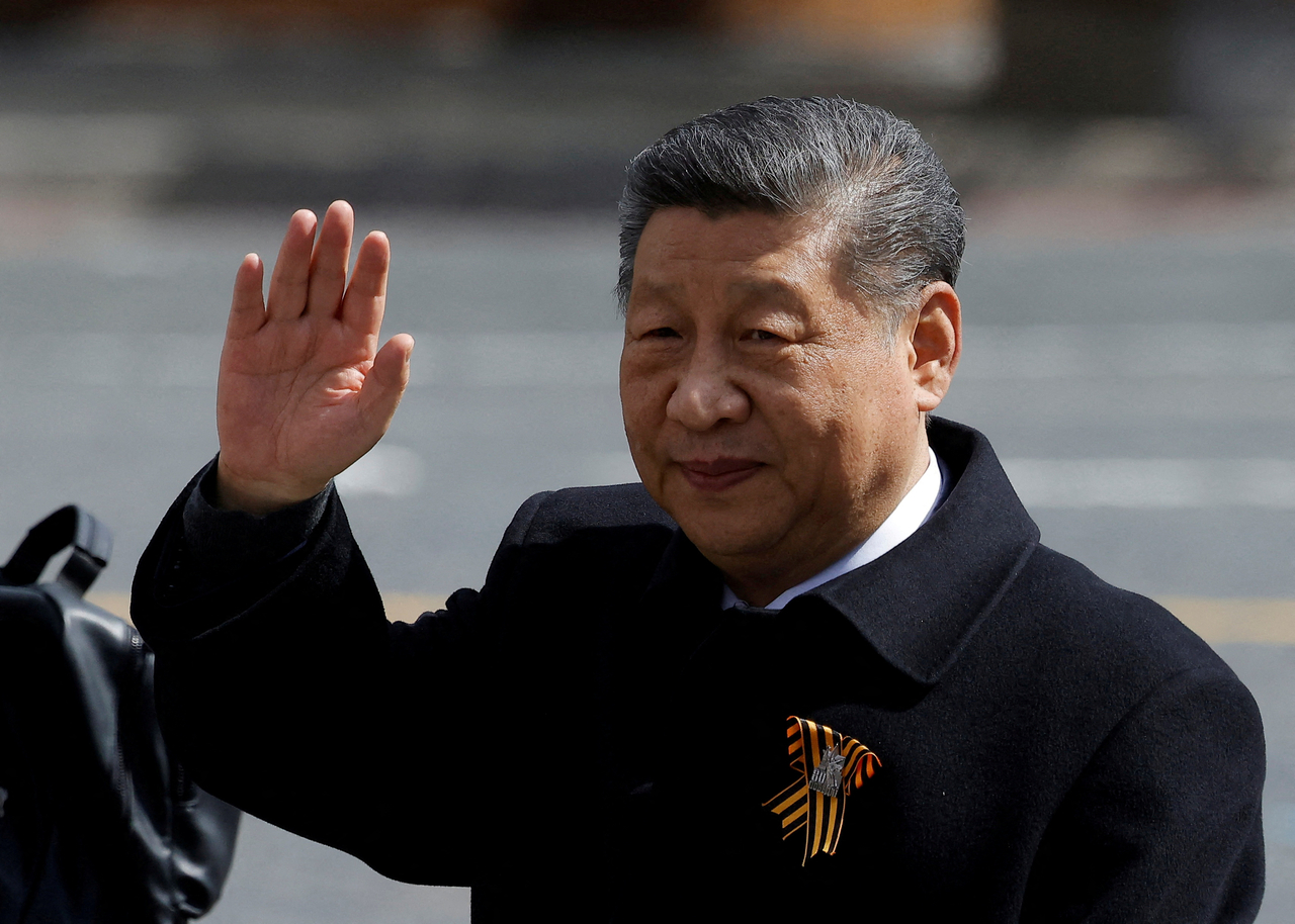Chinese President Xi Jinping waves to spectators as he leaves after a military parade on Victory Day, marking the 80th anniversary of victory over Nazi Germany in World War II, in Red Square in central Moscow, May 9. (Reuters)