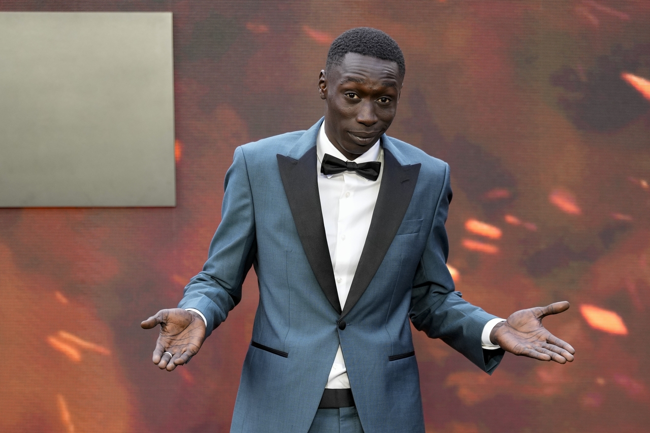 Khaby Lame poses for photographers upon arrival at an event in London, July 13, 2023. (AP-Yonhap)