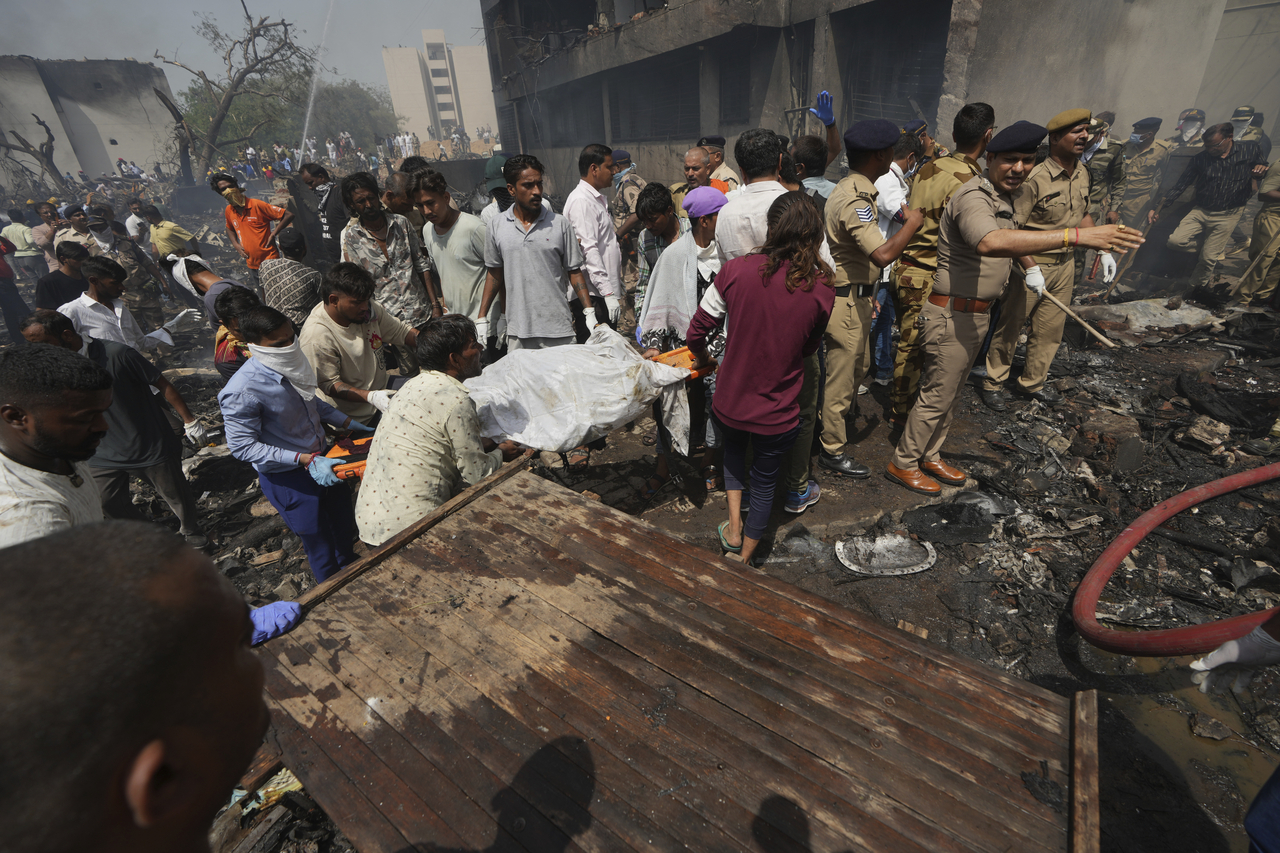 Rescuers work at the site of an airplane that crashed in India's northwestern city of Ahmedabad in Gujarat state, Thursday, June 12, 2025. (AP-Yonhap)