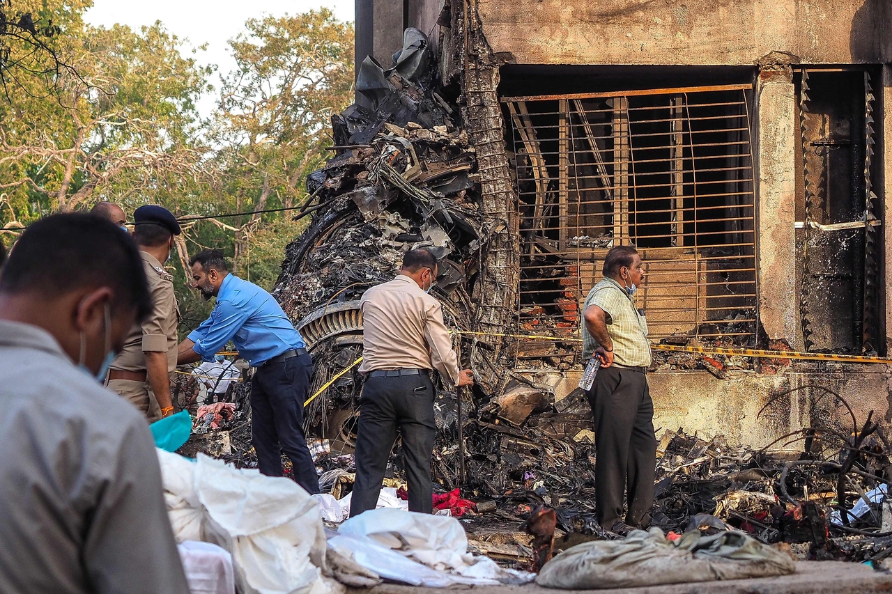 Officials work at the site where Air India flight 171 crashed in a residential area near the airport in Ahmedabad on June 12, 2025. (AFP)