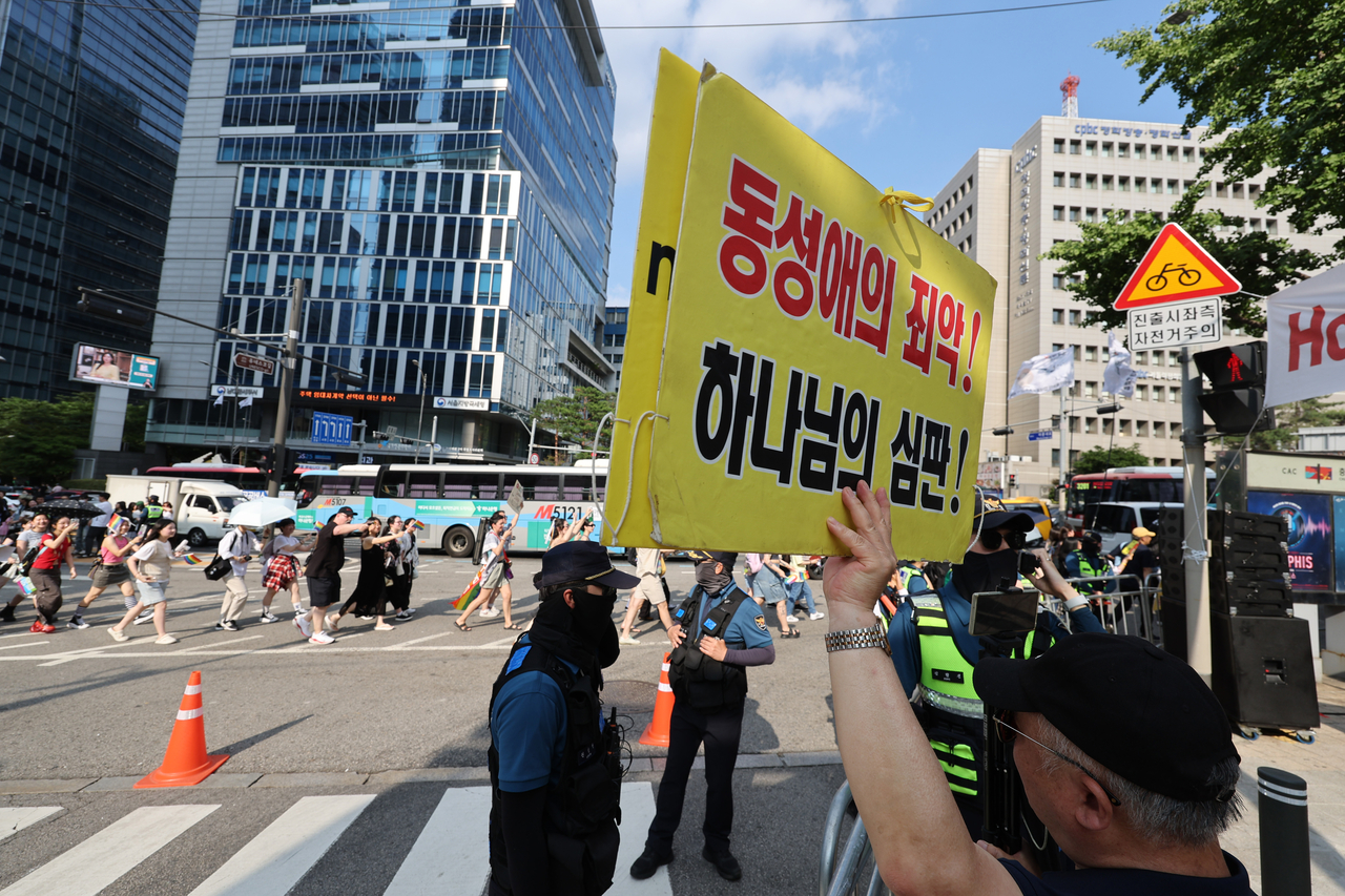 A demonstrator opposing the Seoul Queer Culture Festival is shouting anti-LGBTQ+ slogans during the festival in Seoul on Saturday. (Yonhap)