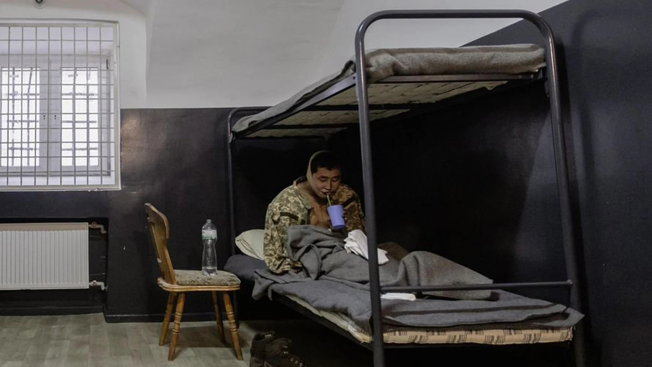 A wounded soldier, suspected to be North Korean and captured by Ukrainian forces in Russia's western Kursk region, is seen in this photo posted on Jan.12. (Ukrainian President Volodymyr Zelenskyy's X account)