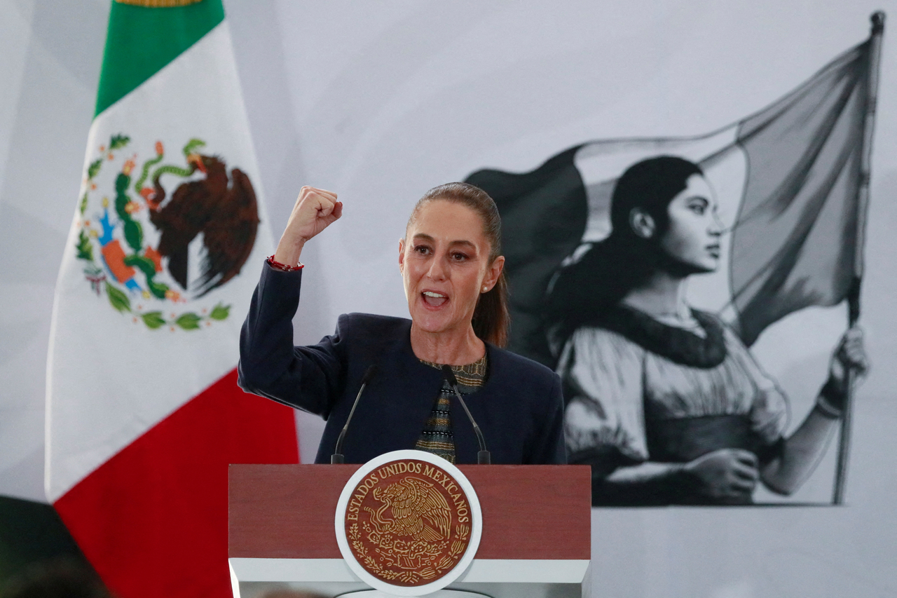 Mexico's President Claudia Sheinbaum raises her fist while speaking during an event marking the 87th anniversary of state oil company PEMEX, founded after the expropriation of foreign oil firms, in Mexico City, Mexico March 18. (Reuters-Yonhap)