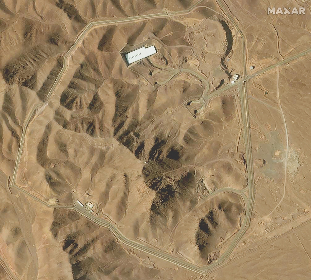 This handout satellite image provided by Maxar Technologies and taken on February 12, 2025 shows an overview of the Fordo (Fordow) uranium enrichment facility, south of the capital Tehran. (AFP-Yonhap)