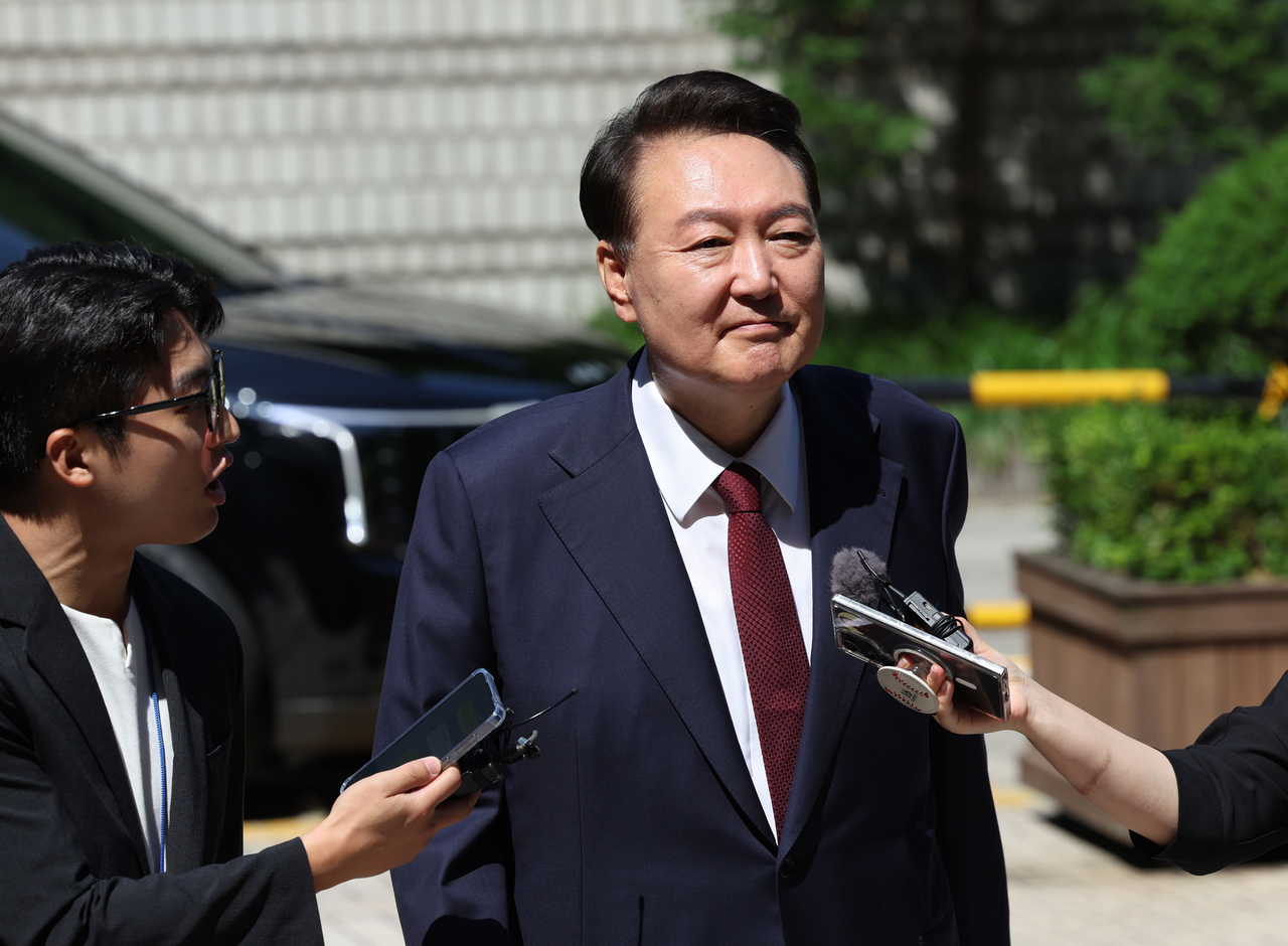 Former President Yoon Suk Yeol appears at the Seoul Central District Court in the capital on Monday to attend the eighth hearing of his trial over insurrection charges in connection with his declaration of martial law. (Yonhap)