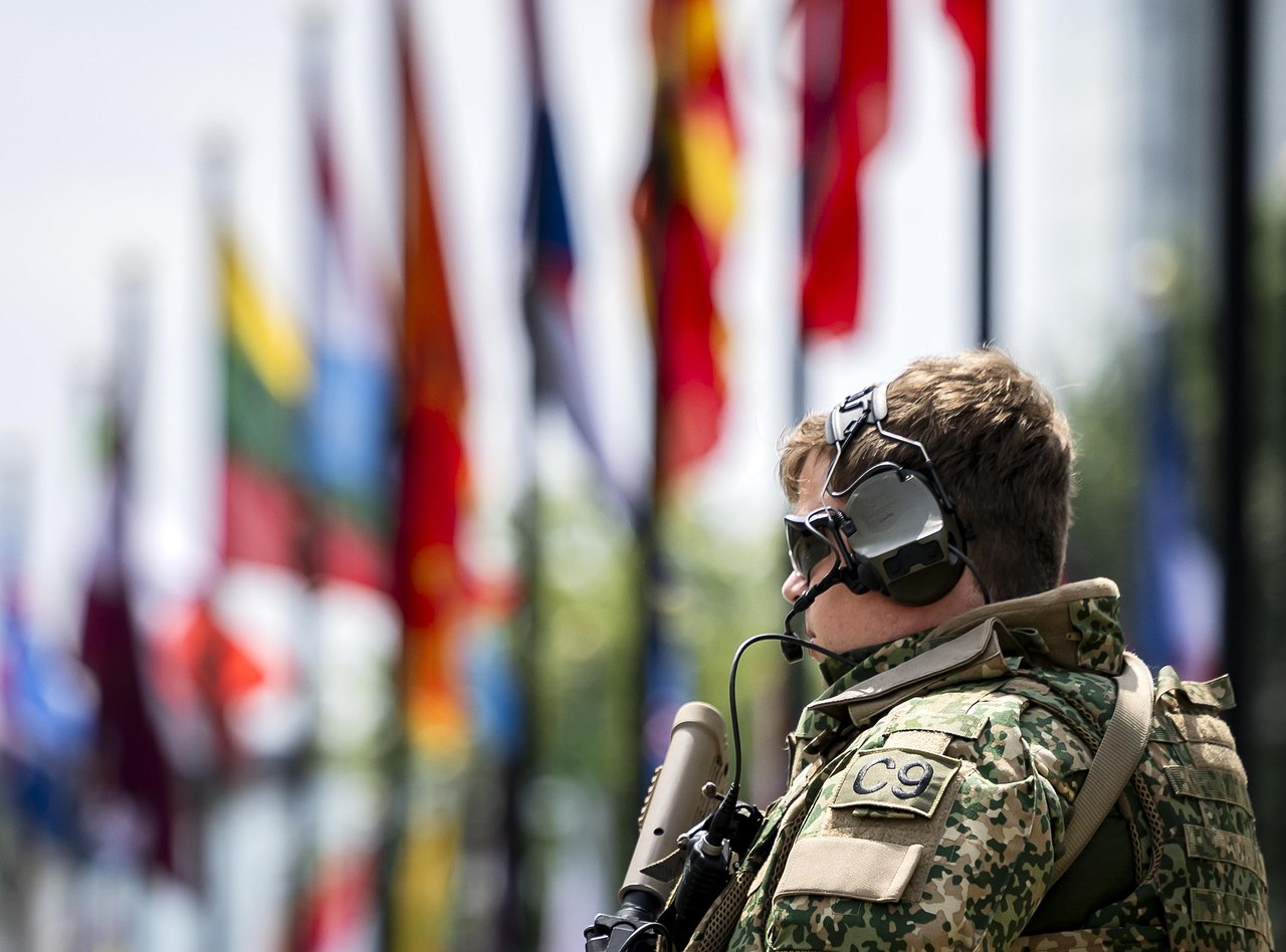 An armed security personnel stands guard at the World Forum, the venue of the NATO summit, in The Hague, Netherlands, Sunday. (EPA-Yonhap)