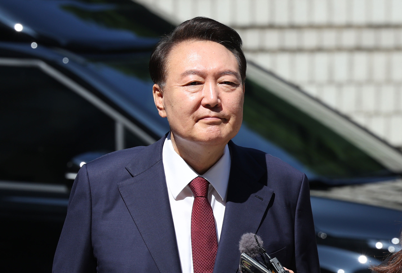 Former President Yoon Suk Yeol appears at the Seoul Central District Court on Monday to attend the eighth hearing of his trial over insurrection charges in connection with his martial law declaration. (Pool photo via Yonhap)
