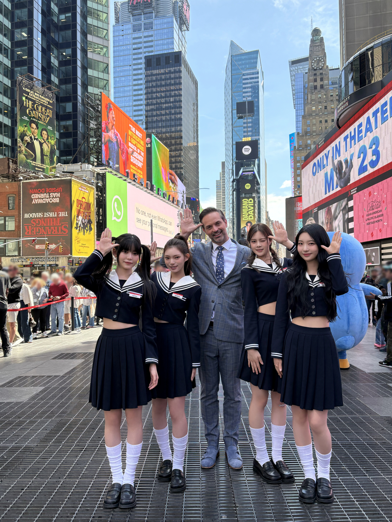 Cosmosy members pose with Nick Kosir (center), an American television meteorologist, at Times Square in New York on May 21. (Sony Music Korea)